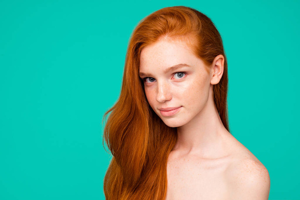 Anti-age concept. Profile side close-up portrait of cute nude sweet adorable red-haired minded girl with shiny pure clean fresh flawless skin and healthy hair, isolated over green turquoise background - Zdjęcie, obraz
