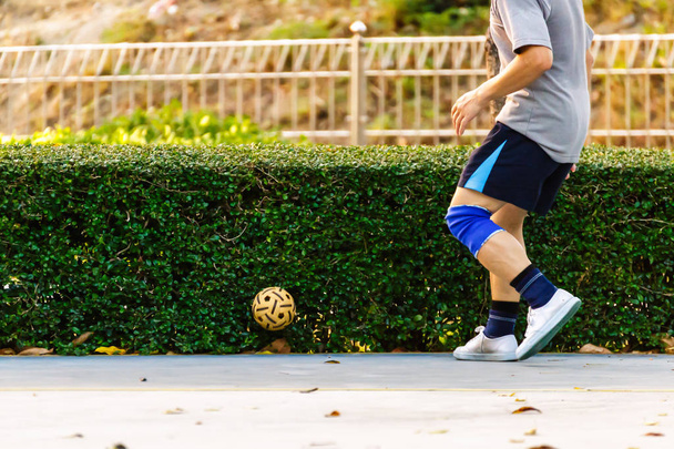 Sport man play rattan ball in the park. - Фото, зображення