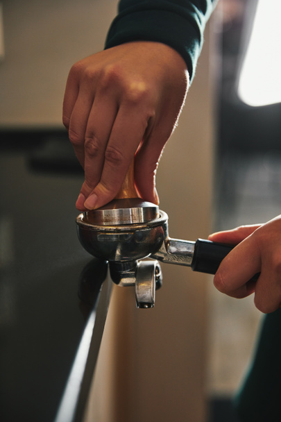 cropped shot of barista preparing espresso in coffee maker     - Photo, Image