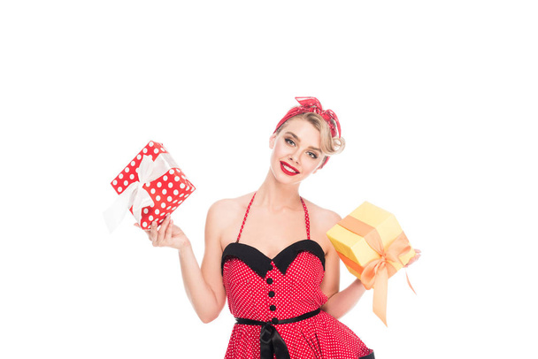 portrait of beautiful pin up woman with wrapped presents isolated on white - 写真・画像