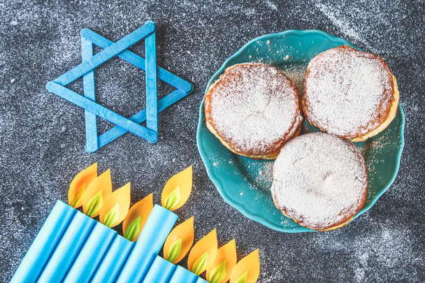 Jewish holiday Hanukkah and its attributes, menorah, donuts, Star of David - Фото, изображение