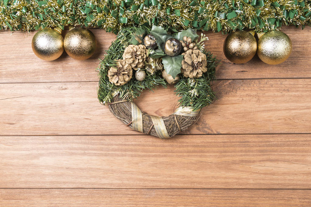 Christmas background with garlands and Christmas decorations on wooden table. - Фото, изображение