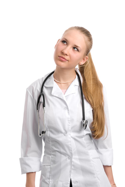 Young attractive female doctor thinking - Φωτογραφία, εικόνα