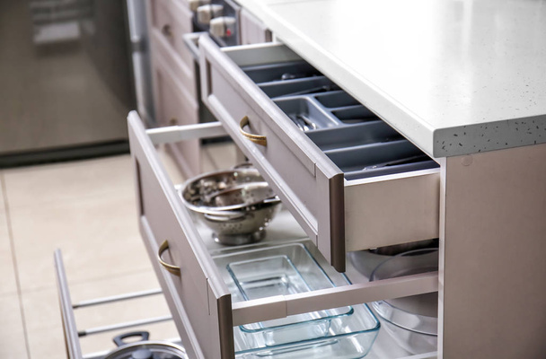 Set of clean kitchenware in drawers - Valokuva, kuva