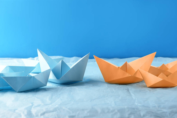 Origami boats on color crumpled paper - Фото, зображення