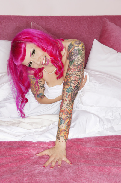 Erotic tattooed woman laughing - Фото, изображение