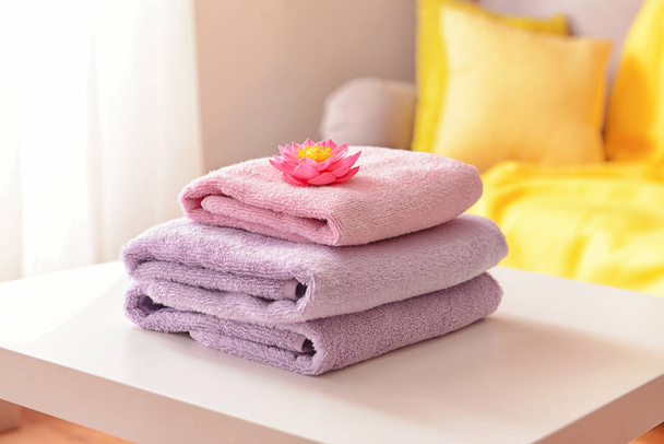 Stack of clean towels on table - Photo, Image