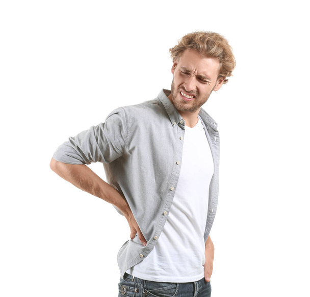 Человек, страдающий от боли в спине на белом фоне
 - Фото, изображение