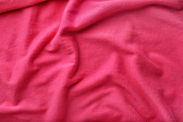 Tekstuuri kirkkaan vaaleanpunainen kangas, lähikuva
 - Valokuva, kuva
