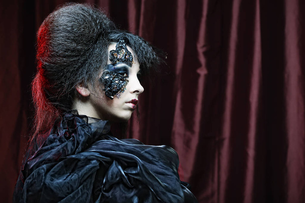 Woman with creative make up. Halloween theme.  - Фото, изображение