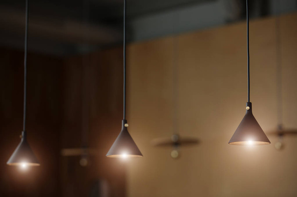 Glowing lamps in loft design interior - Foto, Imagen