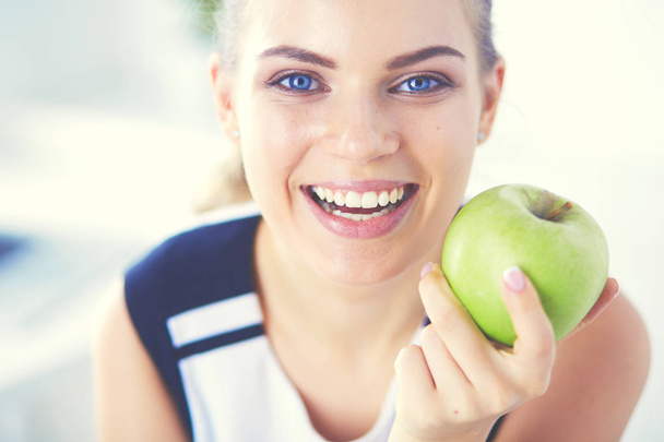 Close up portrait of healthy smiling woman with green apple. - Photo, Image