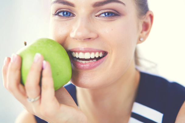Close up portrait of healthy smiling woman with green apple. - Photo, image