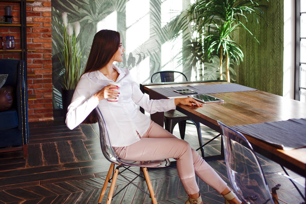 Successful young woman in comfortable loft style office. - Fotó, kép