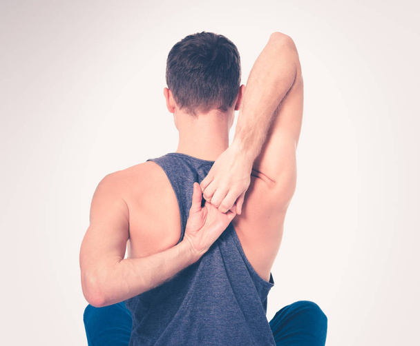 Young man practicing yoga. Yoga. Yoga Instructor - Foto, Bild