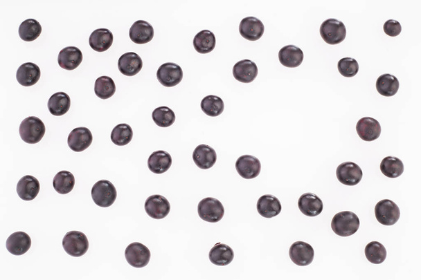 Fresh acai berries - Euterpe oleracea. Space for text - Photo, image