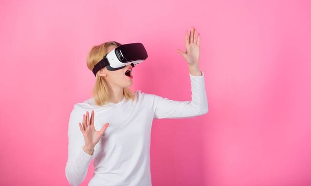 Digital device benefits. Woman head mounted display pink background. Virtual reality and future technologies. Girl use modern technology vr headset. Alternative space. Interact alternative reality - Fotoğraf, Görsel