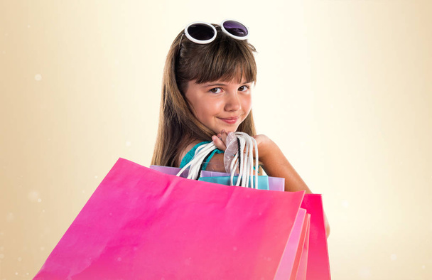 Little cute girl with many shopping bags - Photo, Image
