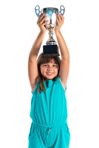Young girl holding a trophy - Fotó, kép