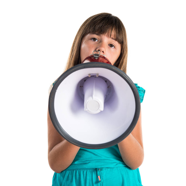 Young girl shouting by megaphone - 写真・画像