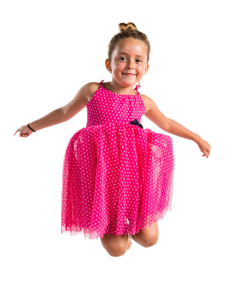 kleines Mädchen mit rosa Kleid springt - Foto, Bild