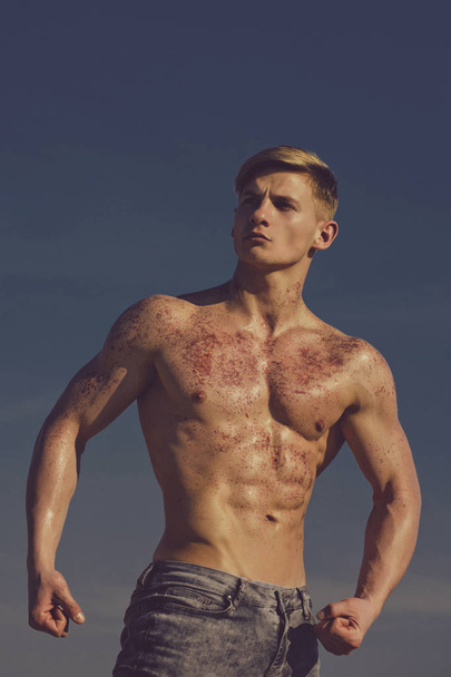 Adam with glitter on bare chest. - Фото, изображение