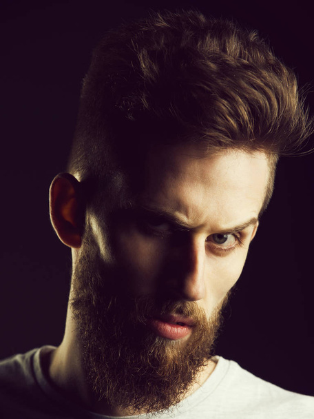man, bearded young hipster has mustache on serious face - Photo, Image