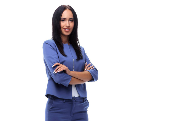 Confident young businesswoman standing with hands in pocket - Valokuva, kuva