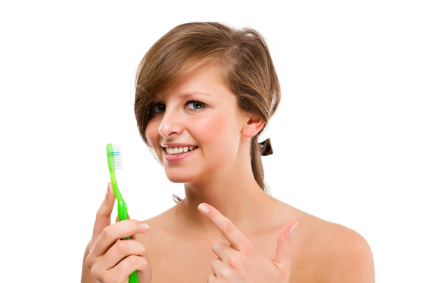 Attractive woman brushing teeth isolated on white background - Foto, Imagem