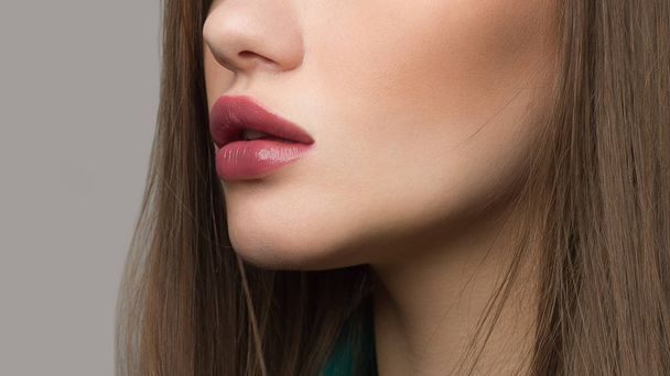 Perfect natural lip makeup. Close up macro photo with beautiful female mouth. Plump full lips. Close-up face detail. Perfect clean skin, light fresh lip make-up. Beautiful spa tender lip - Valokuva, kuva