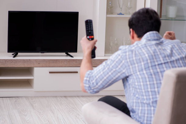 Young man watching tv at home - Photo, Image