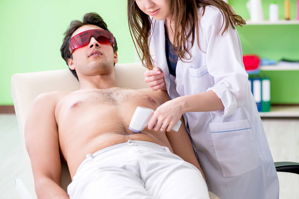 Young man visiting doctor for epilation - Photo, image