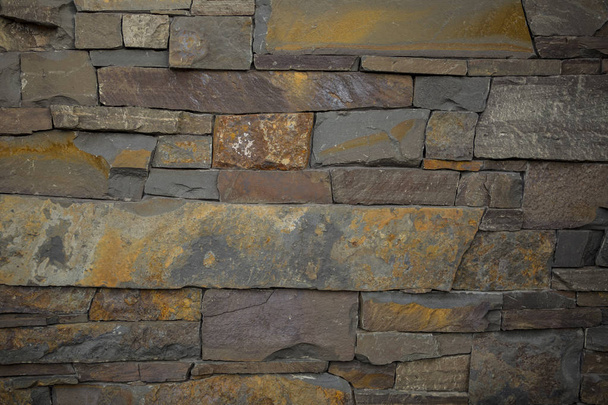 Vista de fachada de la antigua pared de piedra / ladrillo para el fondo de diseño
 - Foto, imagen