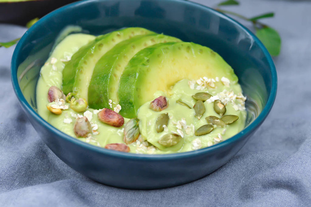 avocado yogurt or blended avocado with pistachio and avocado topping - Valokuva, kuva