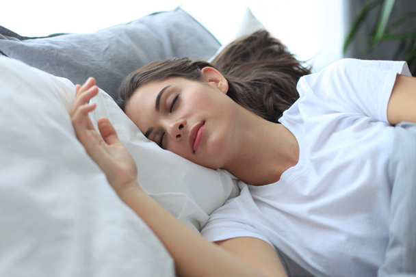 Young attractive woman sleeping in bed at home, - Φωτογραφία, εικόνα