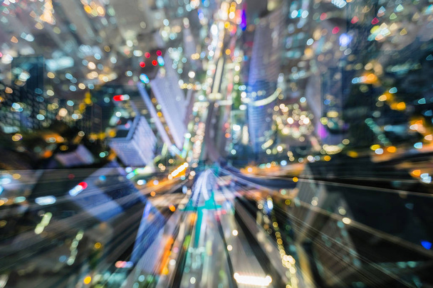 Dubbele blootstelling nacht licht stad centrum met de trein spoor beweging, abstracte achtergrond vervagen - Foto, afbeelding