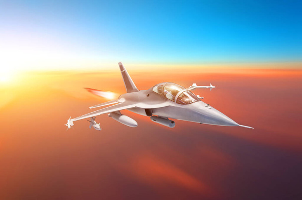Supersonic fighter with arms flies in the sky at sunset with afterburner of engines - Photo, Image