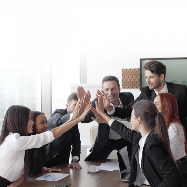 Happy business team making high five with their hands in the office - Фото, зображення