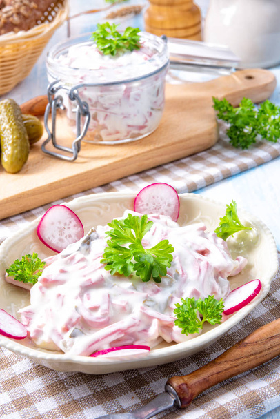 delicious homemade meat salad with mayonnaise and radish - 写真・画像