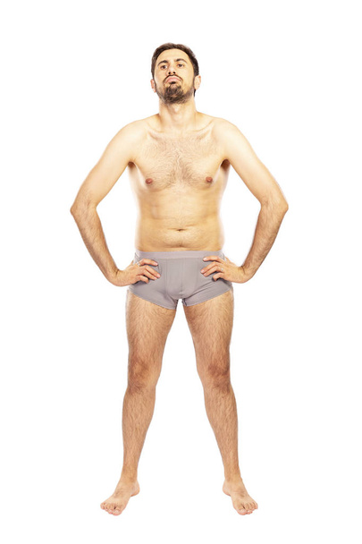Man without clothes, in shorts, isolated on white background - Valokuva, kuva