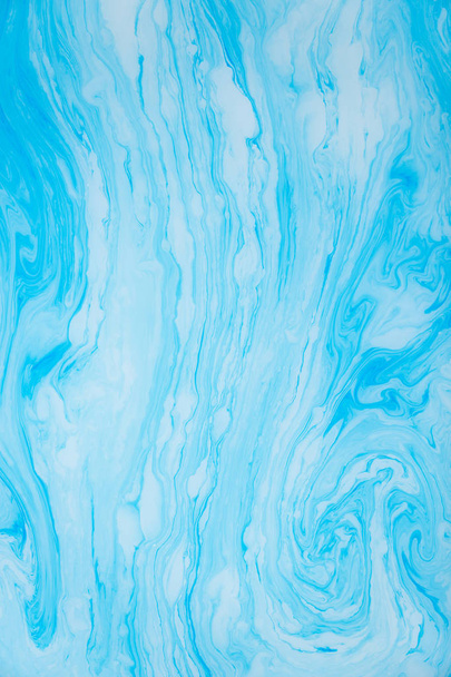 Abstract blue marble background. Stains of paint on the water. - Φωτογραφία, εικόνα