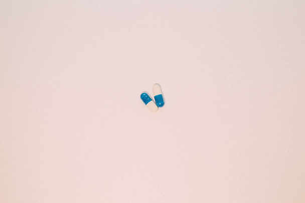 A handful of pills. Capsules medications white and blue. - Valokuva, kuva