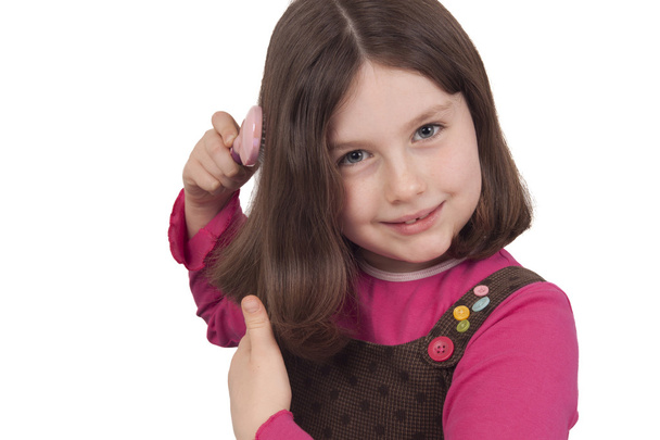 Beautiful little girl combing - Foto, immagini