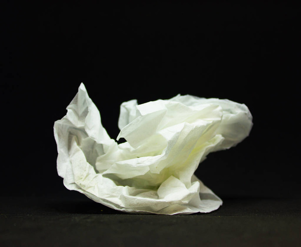 white crumpled napkin on a black background - Foto, imagen