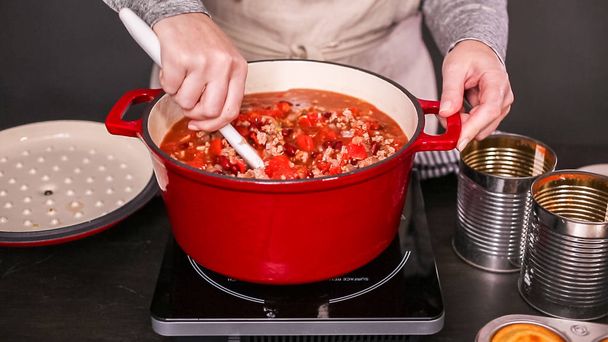 Step by step. Cooking turkey chili in enameled cast iron covered dutch oven. - Photo, Image