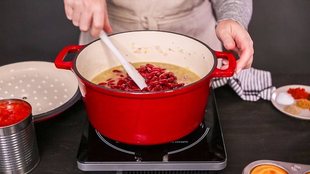 Step by step. Cooking turkey chili in enameled cast iron covered dutch oven. - Photo, Image