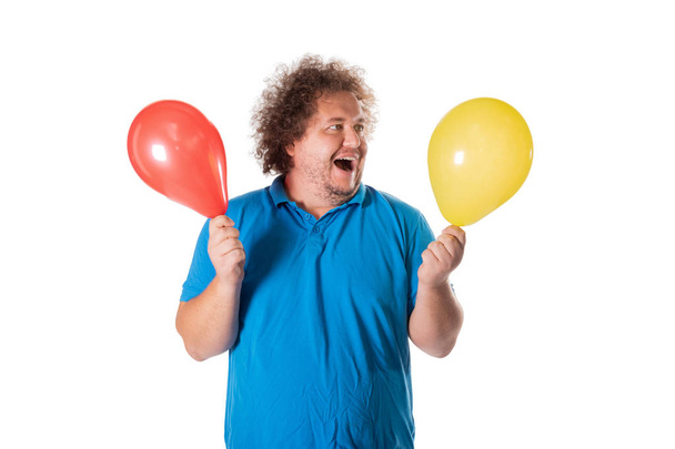 Funny fat man with balloons. Happy birthday. Joy and fun - Foto, Imagem