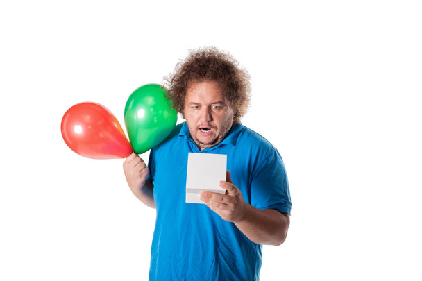 Funny fat man with gift and balloons. Happy birthday. Joy and fun - Foto, Imagem