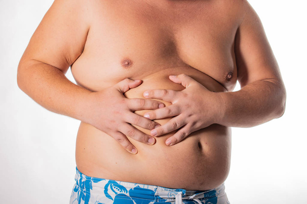 Fat man with big belly. Health problems. Obesity, a sick liver - Fotoğraf, Görsel