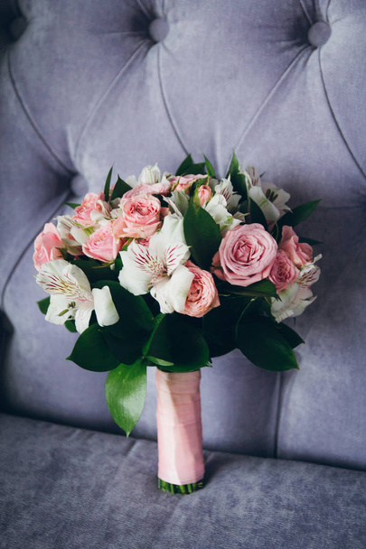 Beautiful bouquet of roses in the interior. Wedding accessories. - 写真・画像